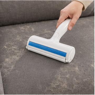 Roll over the surface with the reusable pet hair roller